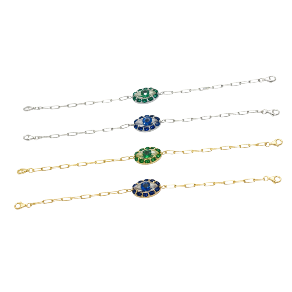 Set of four bracelets with gemstone accents on a white background